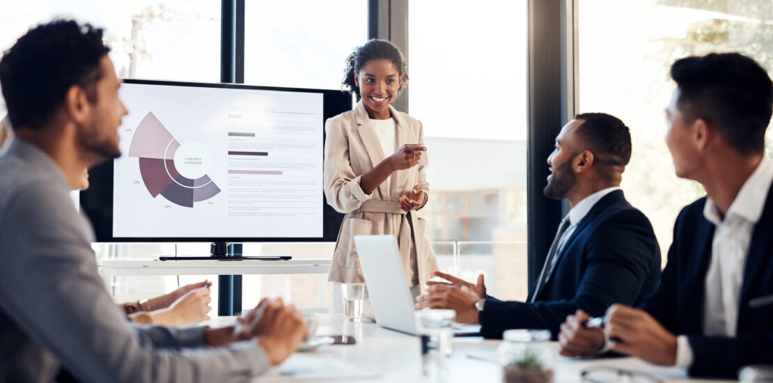 Shot of a young businesswoman delivering a presentation to her colleagues in the boardroom of a modern office