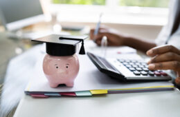 African American Women Accounting With Graduation Cap