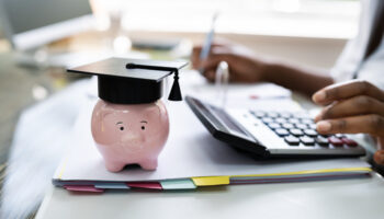 African American Women Accounting With Graduation Cap